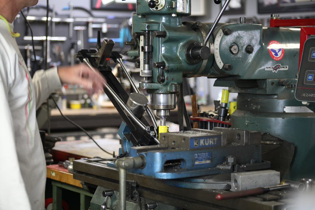 Here is our Anvil seat stay fixture on a vertical mill. The fixture allows me to hold the stays in relation to each other and cut them both at the same time.