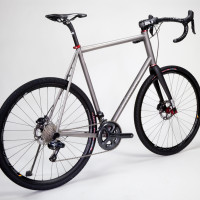 Titanium gravel bike fora  tall rider. Ultegra Di2, White Industries/Hed wheels, Enve fork and cockpit.