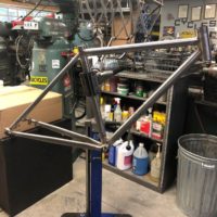 Titanium gravel frame with flat-mount disc brakes. Ready for final finish and assembly.